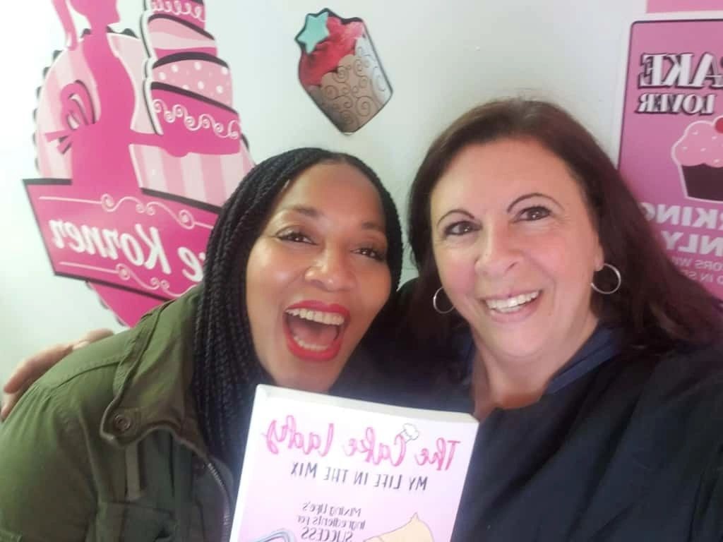 Two women smiling at Kake Korner