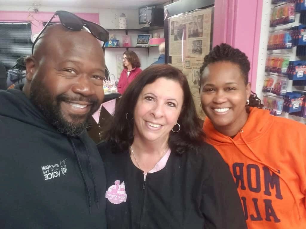 Friends smiling inside Kake Korner